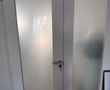White wood and glass interior door