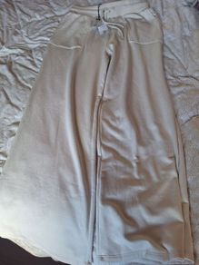 Trousers label still on