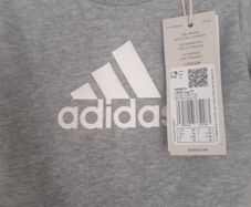 New baby boy bundle with tags .Consists of Addidas tracksuit . Name it top .Hat and gloves .pack of 7 pair socks .2 pair of rattle socks and free sunhat new  and green cable jumper all new  17 euro the lot