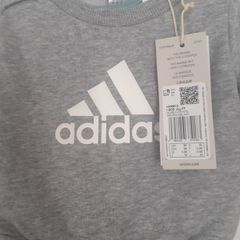 New baby boy bundle with tags .Consists of Addidas tracksuit . Name it top .Hat and gloves .pack of 7 pair socks .2 pair of rattle socks and free sunhat new  and green cable jumper all new  17 euro the lot
