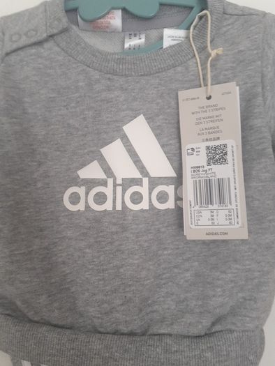 New baby boy bundle with tags .Consists of Addidas tracksuit . Name it top .Hat and gloves .pack of 7 pair socks .2 pair of rattle socks and free sunhat new  and green cable jumper all new  17 euro the lot