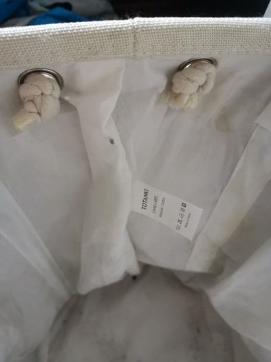 Laundry bag with rope handles. Grey and cream fabric.