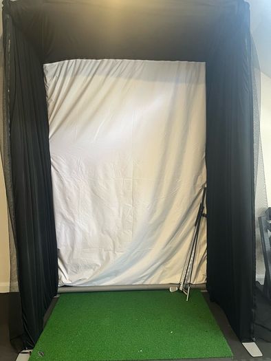 Golf simulator enclosure and impact screen