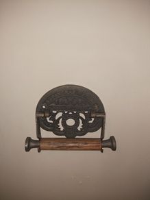 Cast iron toilet holder