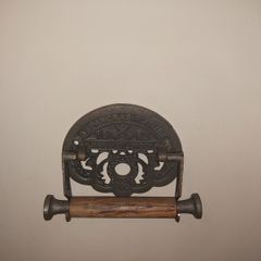 Cast iron toilet holder