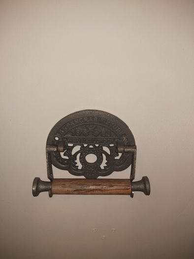 Cast iron toilet holder