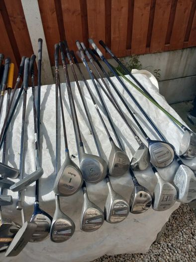 A selection of Golf clubs. Bags and golf balls.