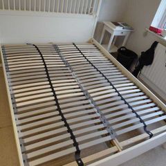White wooden bed frame with slatted base