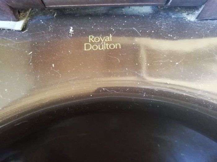 Cast iron brown bath with fittings, brown Royal Dalton toilet and cistern, brown wash hand basin with taps.