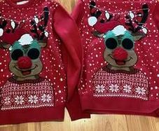 Two matching light-up Christmas reindeer jumpers
