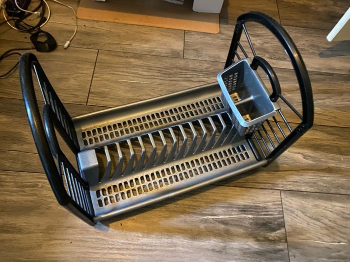 Black and grey plastic kitchen dish drying rack