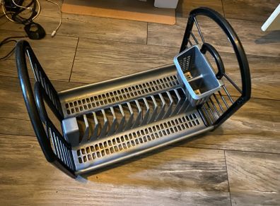 Black and grey plastic kitchen dish drying rack