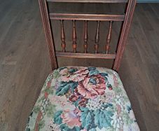 Vintage wooden chair with floral upholstery