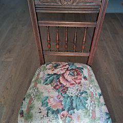 Vintage wooden chair with floral upholstery
