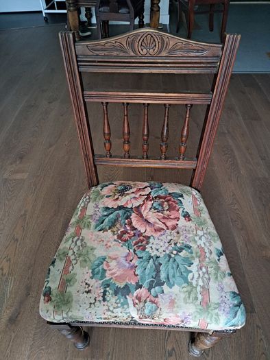 Vintage wooden chair with floral upholstery