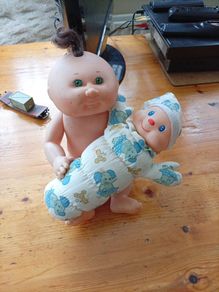 Cabbage patch doll and glo worm doll