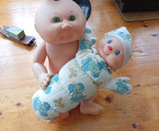 Cabbage patch doll and glo worm doll