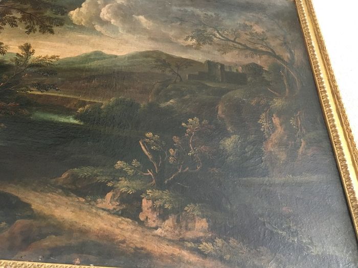 Circle of Francesco Zuccarelli  mountainous landscape by a lake with a fortress