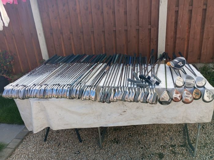 A selection of golf clubs and bags. All right handed clubs.
