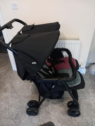 Joie double baby's buggie with rain covers