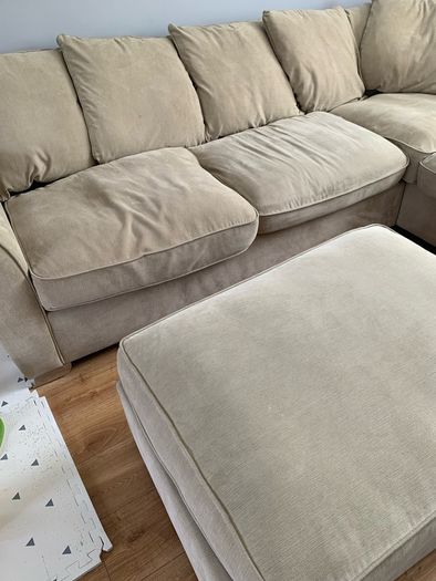 Corner sofa with footstool