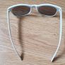 A Pair of White Sun Glasses Image 2
