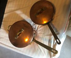 Vintage castle copper saucepans