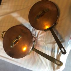 Vintage castle copper saucepans
