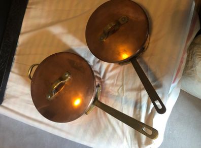 Vintage castle copper saucepans