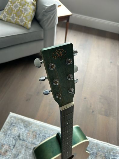Acoustic guitar with strap, bag, stand and accessories