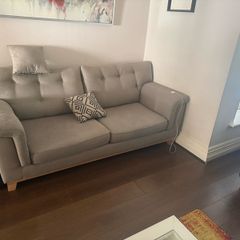 Grey 2-seater sofa with navy ottoman