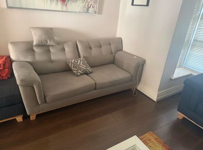 Grey 2-seater sofa with navy ottoman