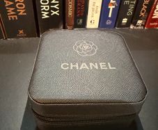 Chanel-inspired earrings presented in an elegant Chanel-style jewellery box