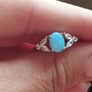 Ring made of 925 silver with oval opal of blue shade and cubic zirconia. Image 5