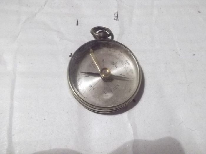 a  antique pocket compass  working