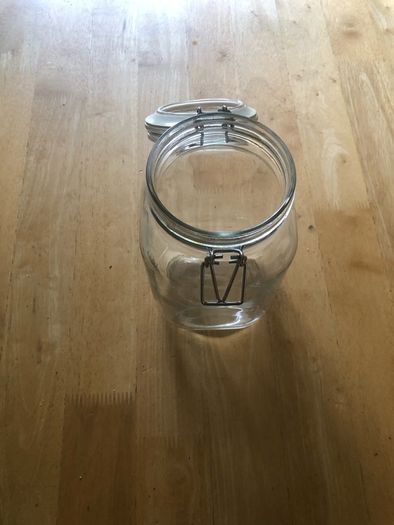 Airtight glass storage jar with clasp