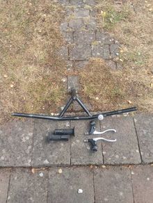 Handlebars, brake levers, hand grips.
