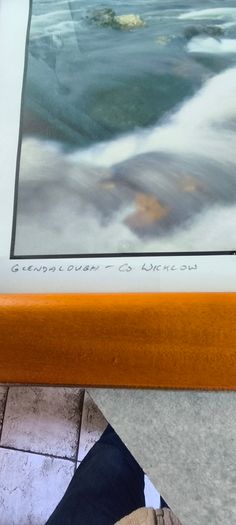 Framed Photograph art print depicting a rushing stream or waterfall, labeled -Glendalough - Co Wicklow- and hand-signed by the artist by Michael Walsh.