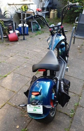 Fully Electric Chopper/Harley looks like a motorbike with matching side boxes