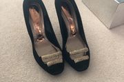 Black material shoe with beaded front