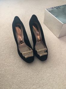 Black material shoe with beaded front