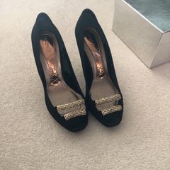 Black material shoe with beaded front