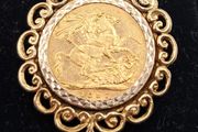Full sovereign coin mounted in 9ct yellow gold pendant