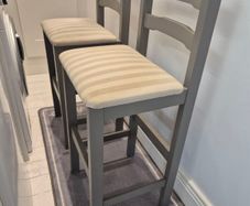 2 wooden counter stools