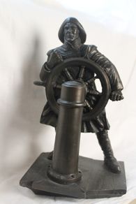 Bronze helmsman figurine