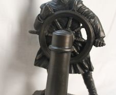 Bronze helmsman figurine