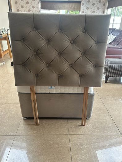 Two single beds with mattresses and headboards