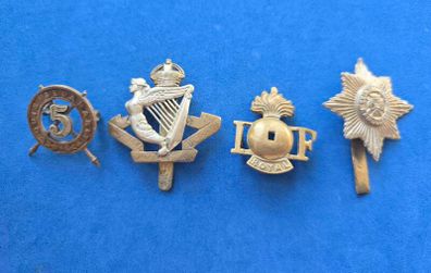 Some broken Irish military badges