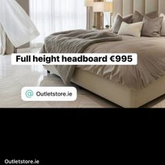 Full wall height headboard in cream boucle fabric