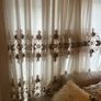 5 decorative pillows with a large beautiful laces curtain in brown and white colors Image 3